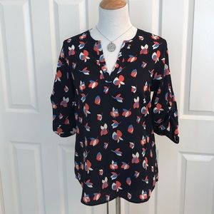 Pixley blue flowered top with tab sleeves.